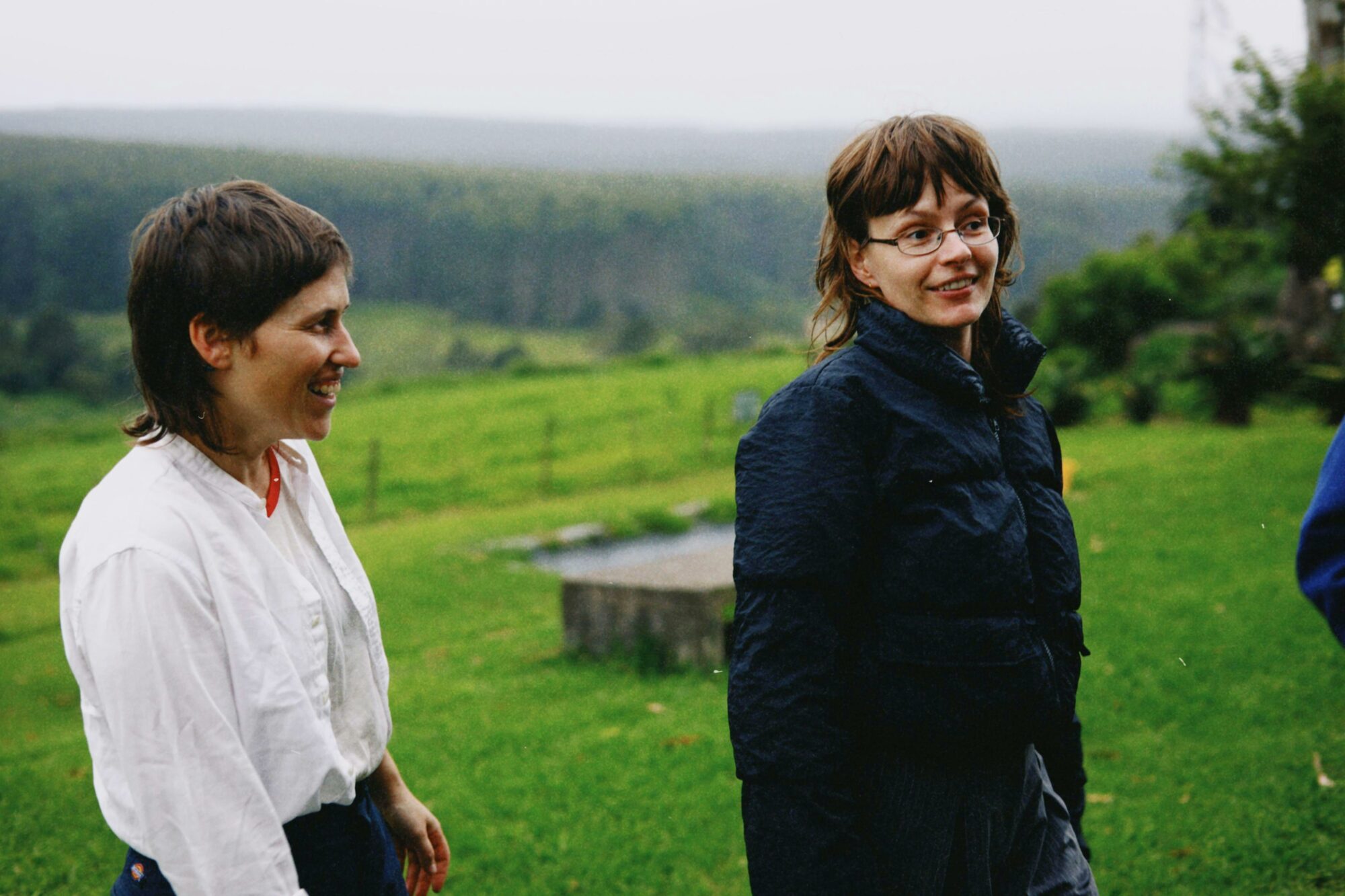 Mimi and Ruby standing side by side in a green field