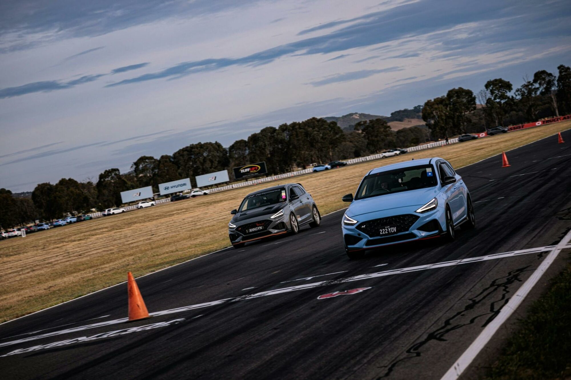 2 cars crossing a finishing line