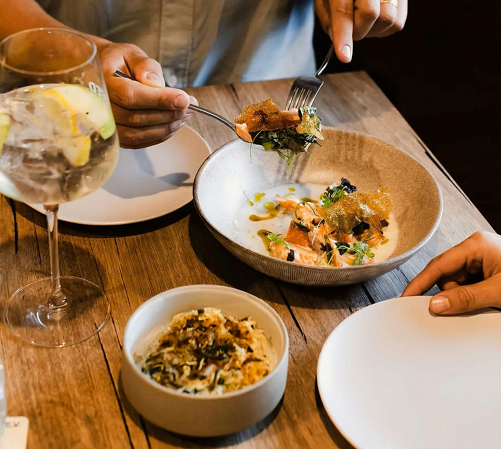 Plates of food with a cocktail
