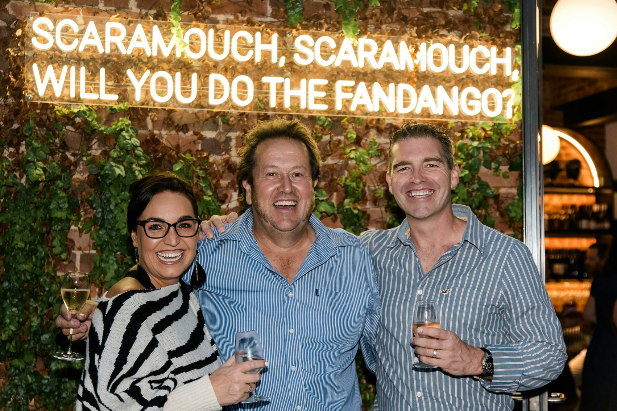 Two guests and a winemaker gather at the Victoria Rutherglen