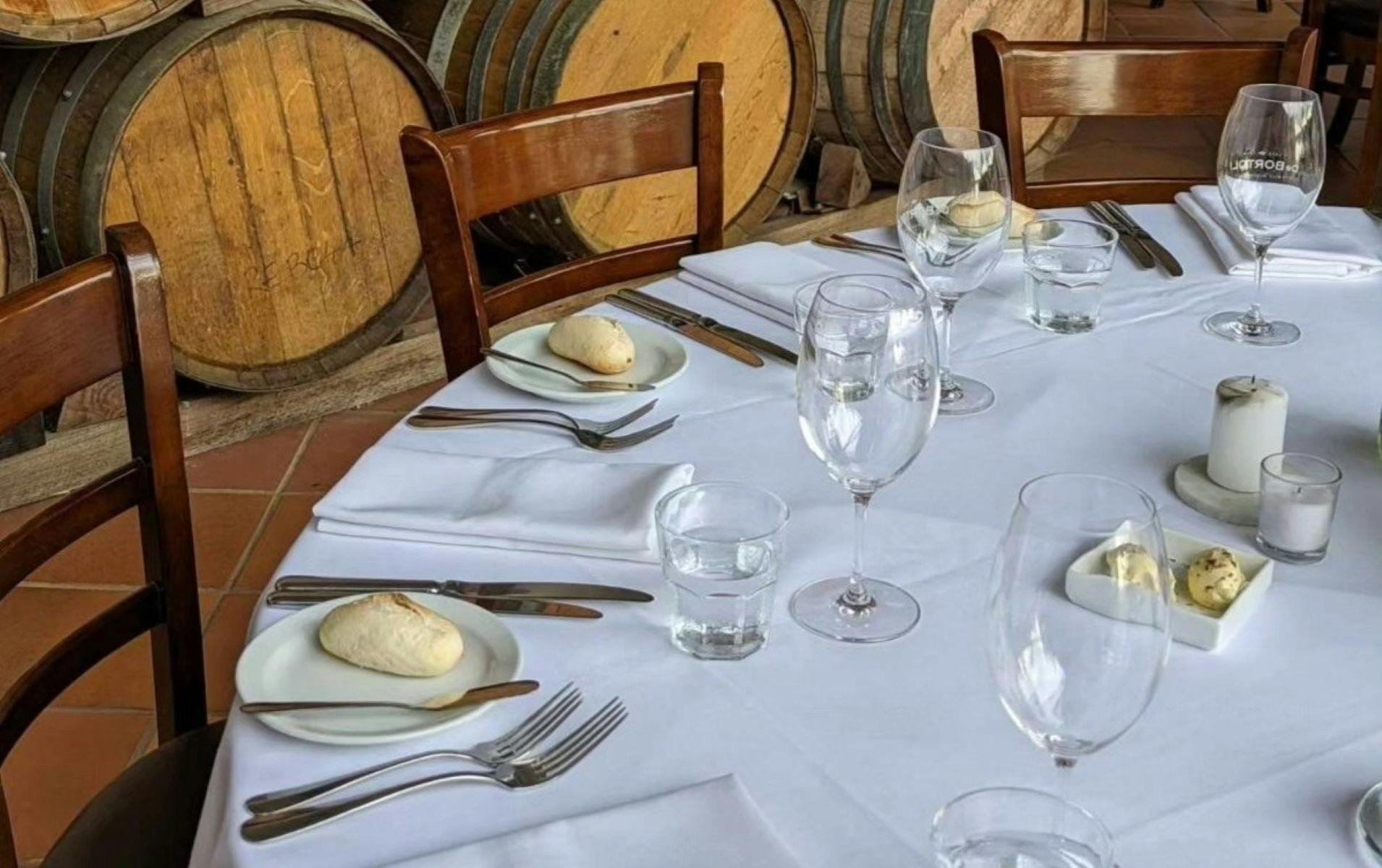 Table set for Presentation Dinner, with wine glasses.