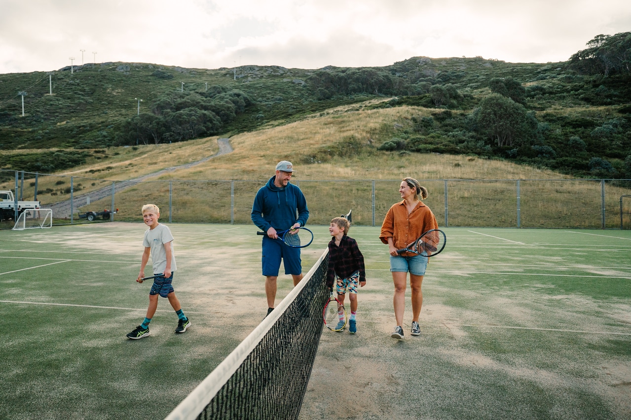 Family playing tennis
